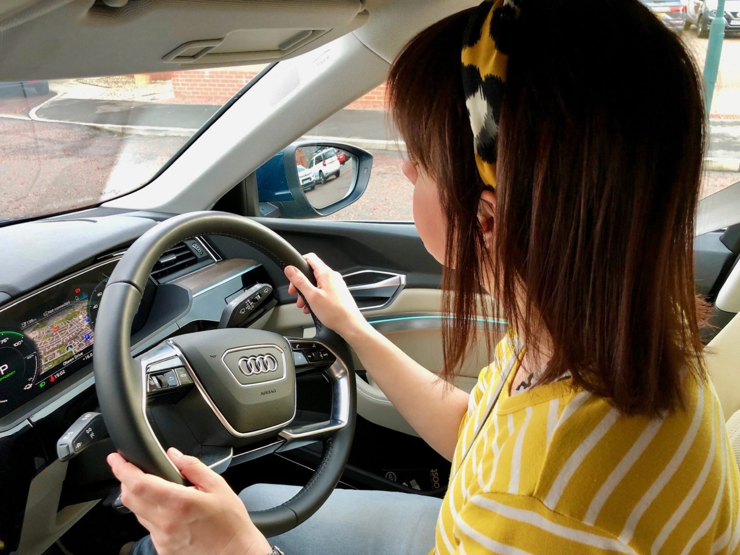 Woman driving an electric car