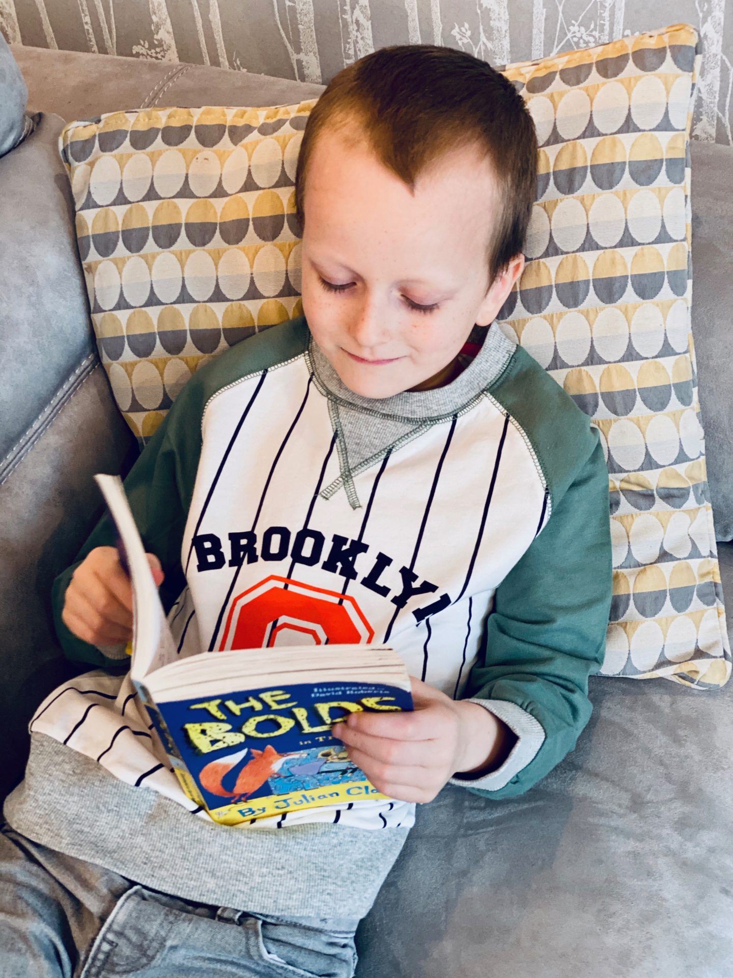 Letter to my first born on his 8th birthday - boy reading book