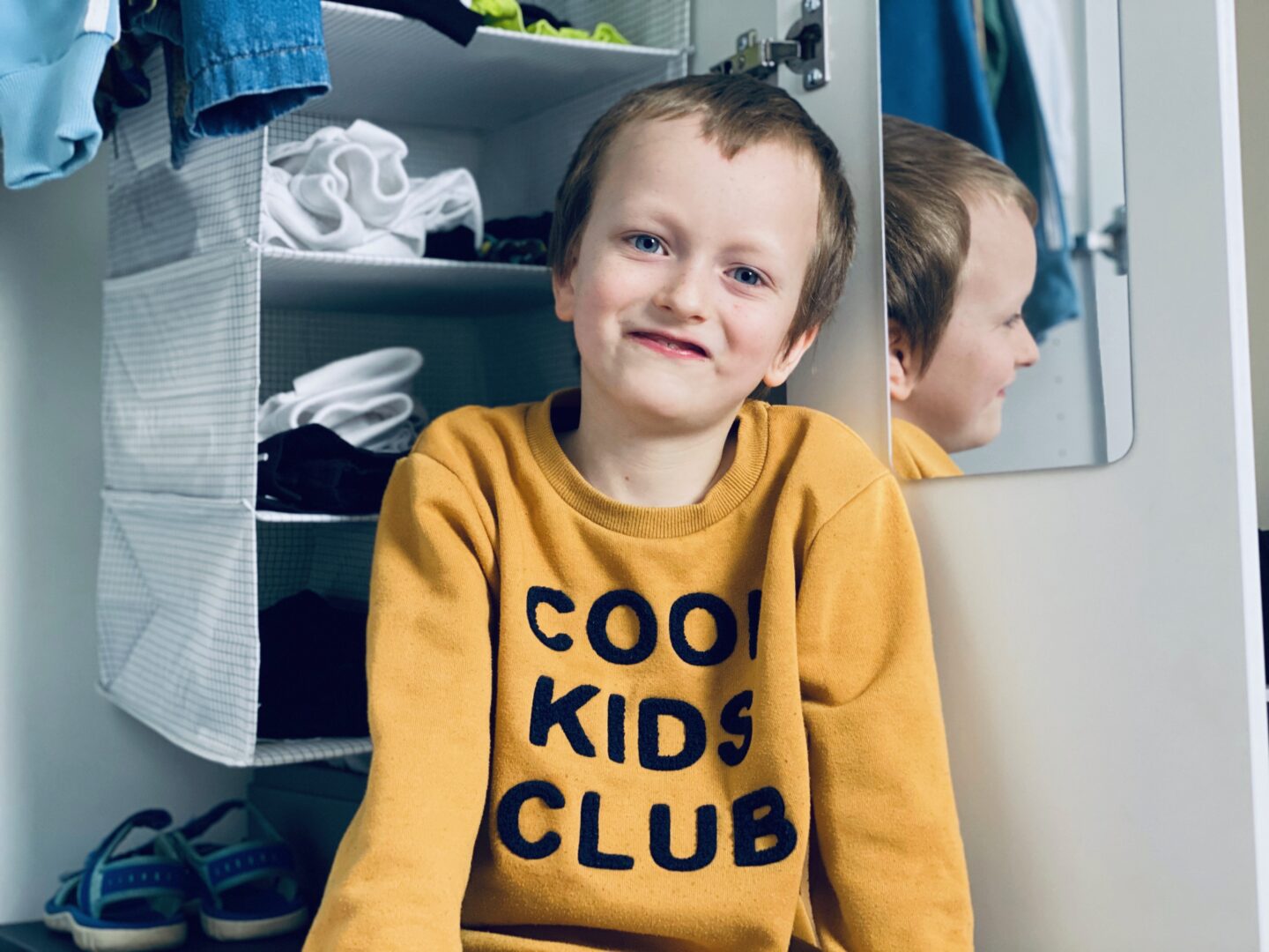 8 year old boy and IKEA wardrobe hanger.