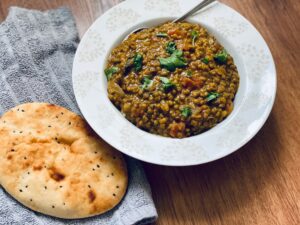 A slow cooker vegan mung bean and spinach dahl recipe that contains 3 of your 5 a day and 15g of protein that you can make for roughly £3.