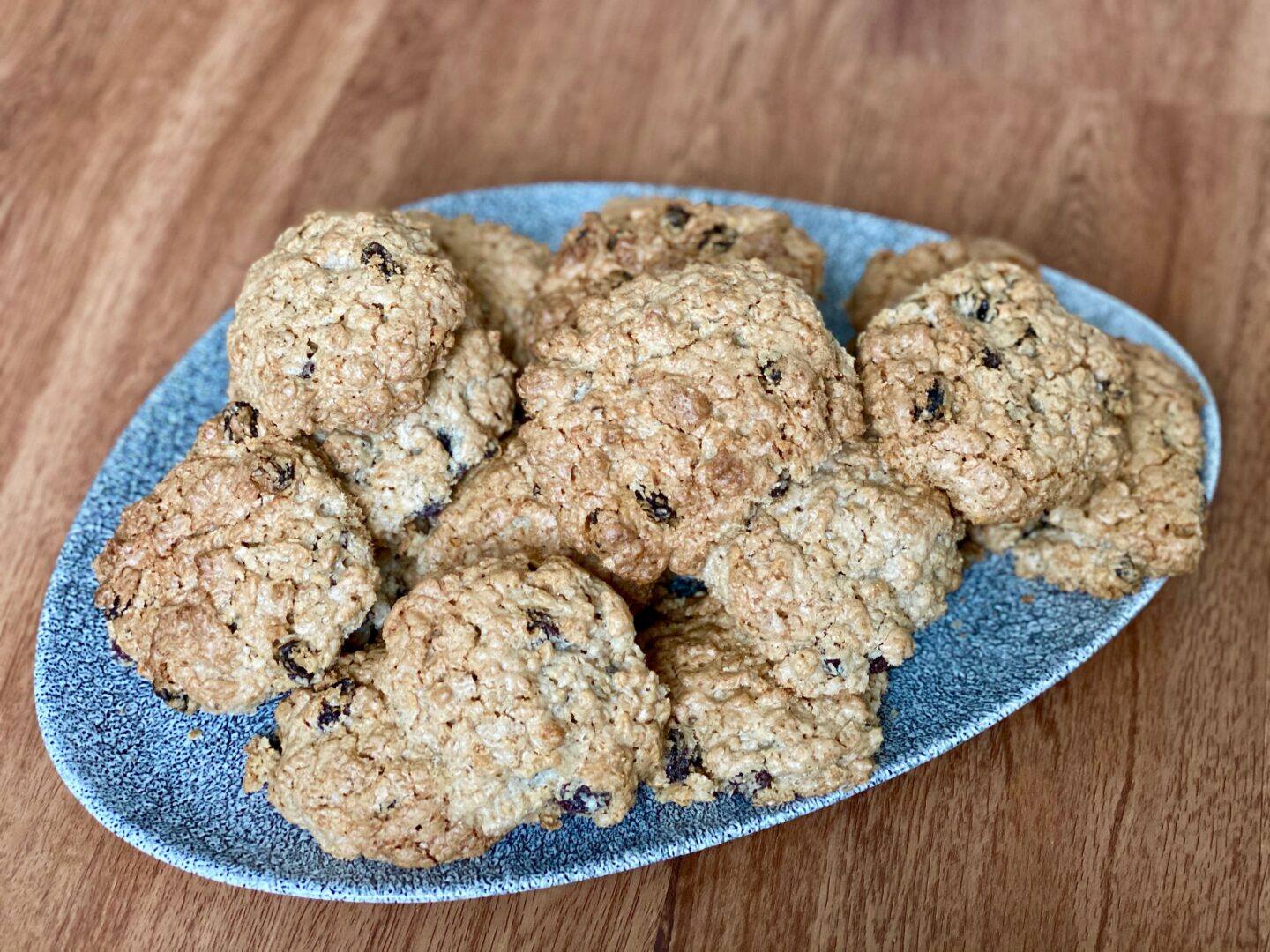 Dairy free cinnamon and raisin oatmeal cookies on a plate.