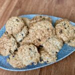 Dairy free cinnamon and raisin oatmeal cookies on a plate.