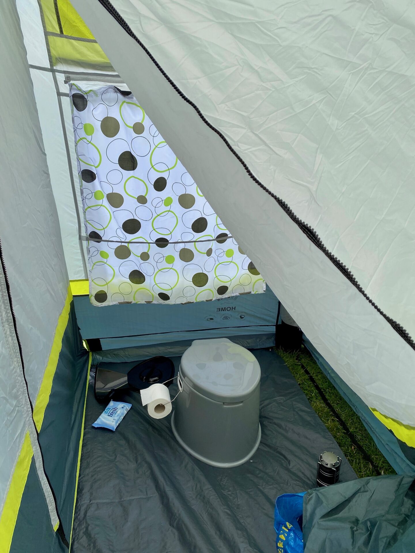 Toilet area of the porch - it's spacious with a toilet, toiler roll, wipes and a lamp set up.