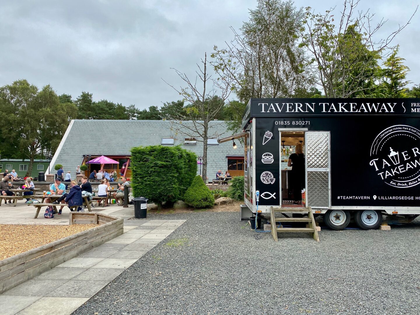 A takeaway truck and picnic tables 