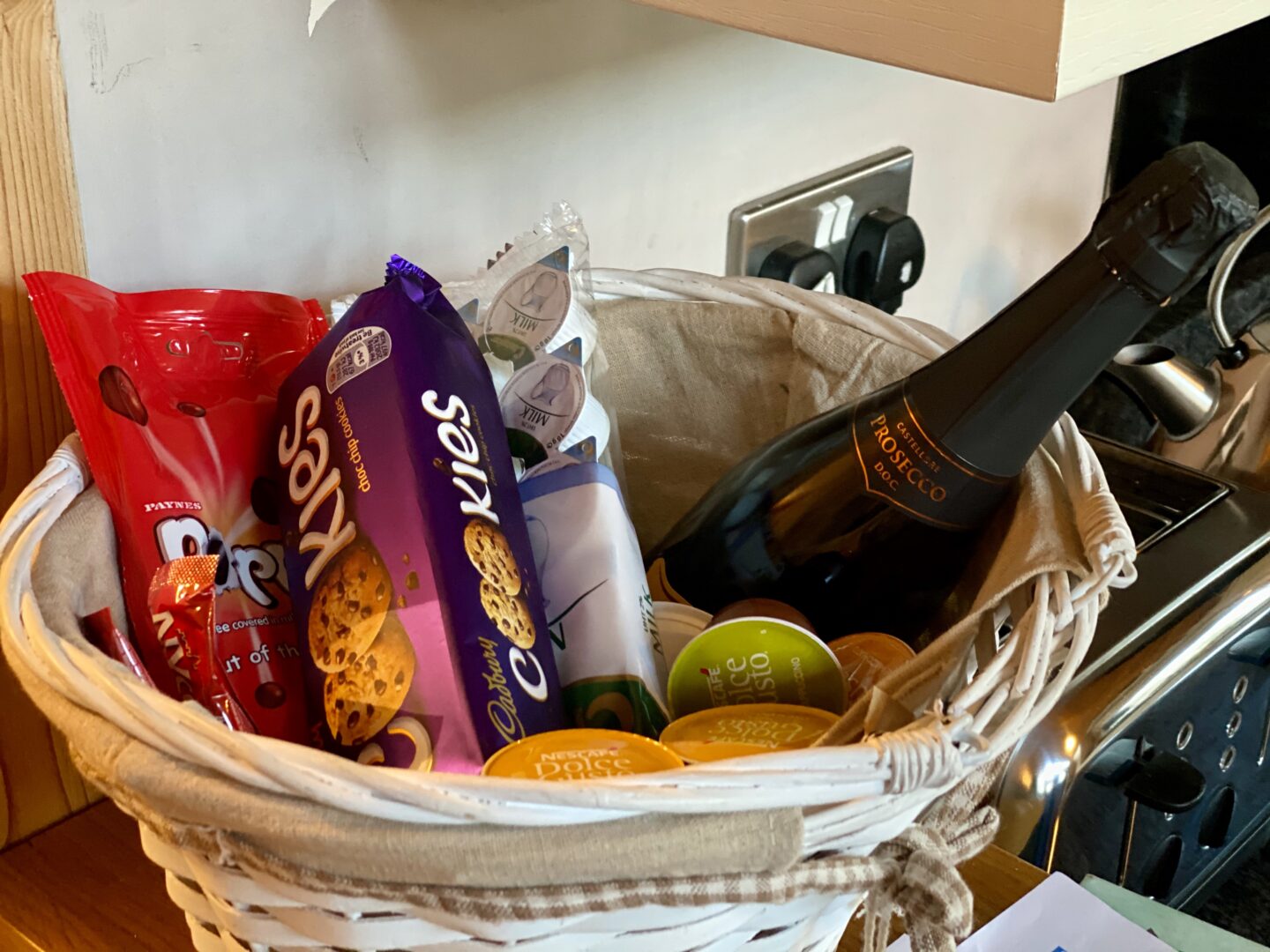 Welcome basket at the Snug with cookies, chocolate, prosecco and teas, coffees etc