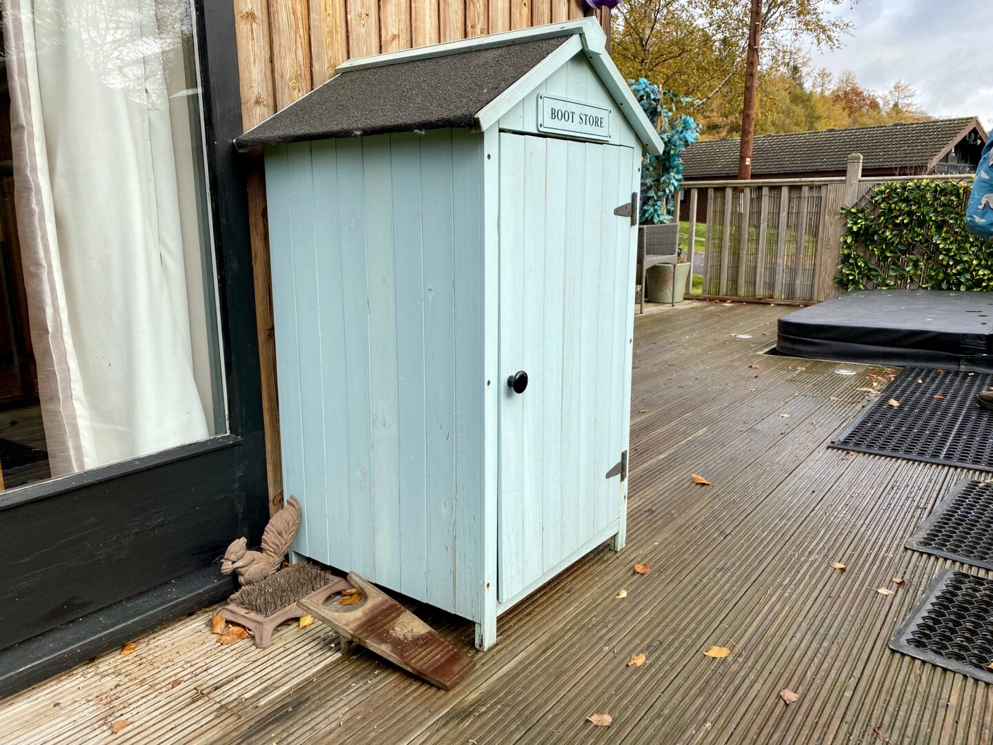 A little outdoor cupboard for wellies at the Snug