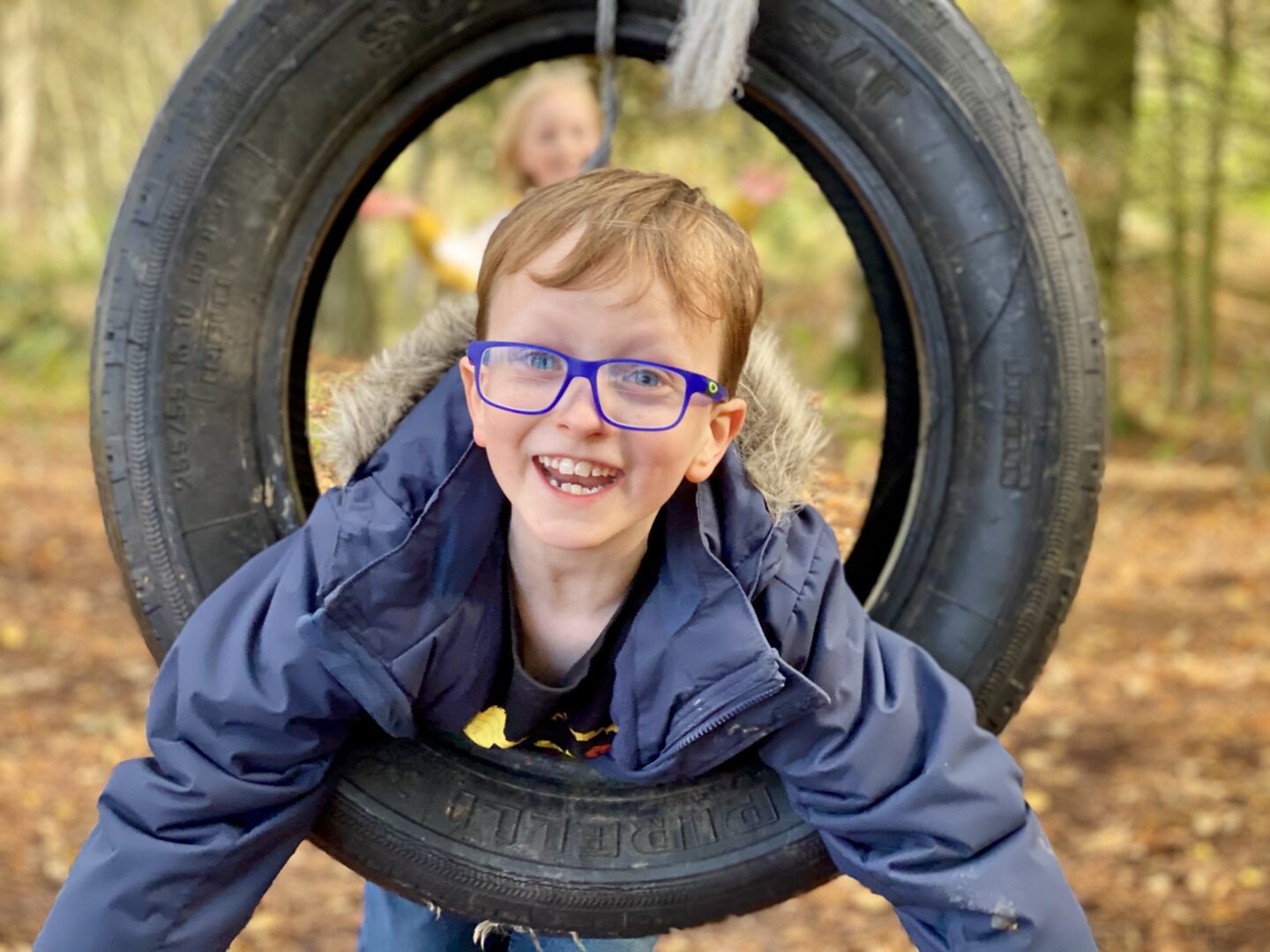 Boy on tyre swing