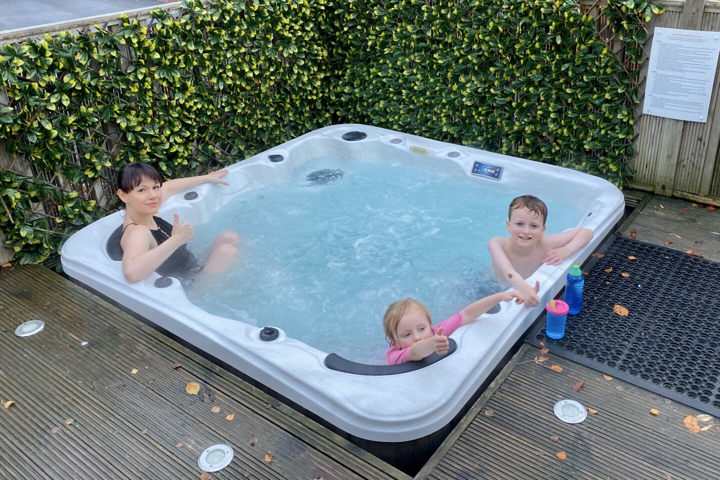 Woman and two children in the hot tub