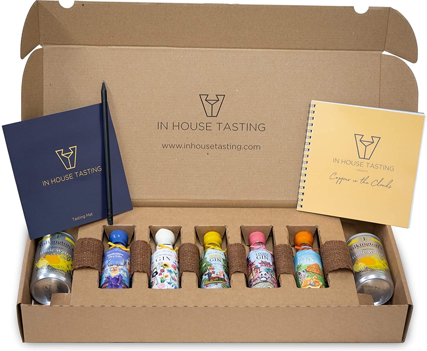 A box containing a gin tasting kit - small gin samples and mixers 