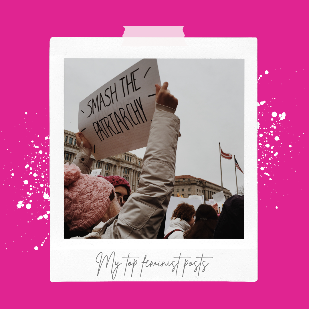 A woman at a rally holding up a smash the patriarchy sign