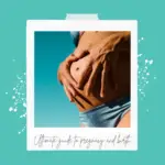 A pregnant stomach with hands on it against the background of a sunny sky