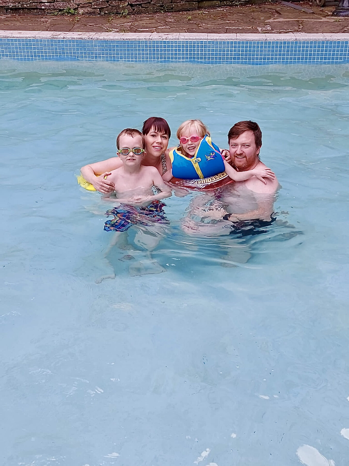 A family of 4 in the pool at Slade House, Angus, Scotland
