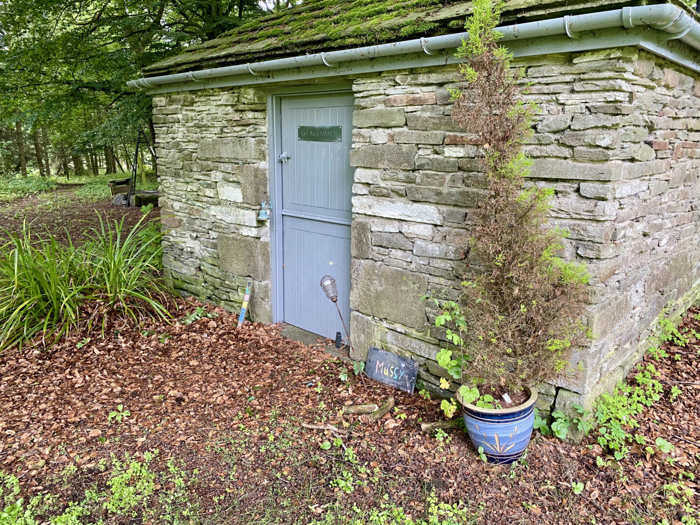 a little outhouse with a blue door for kids at Slade House, Angus, Scotland
