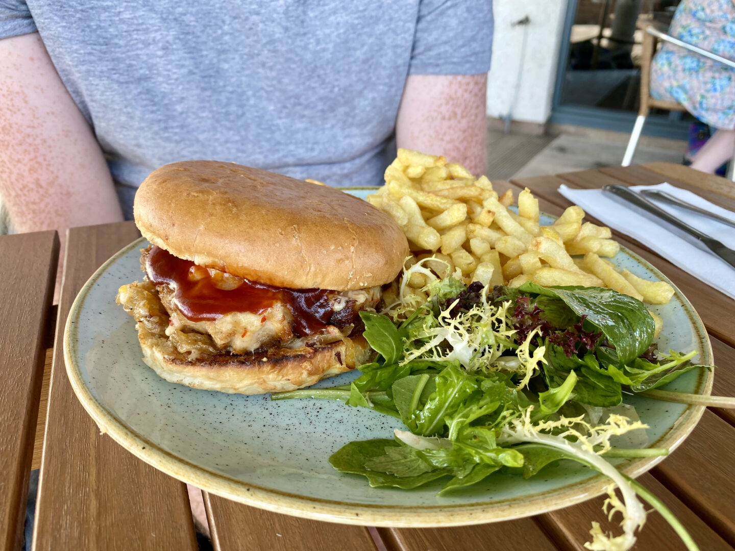 A burger, fries and salad