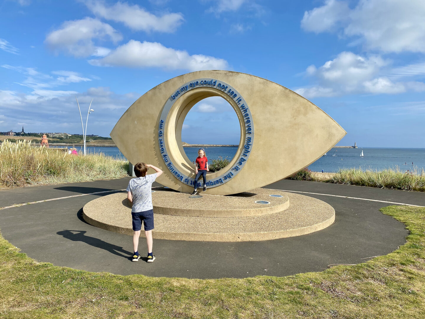 A public art sculpture that looks like a large stone eye