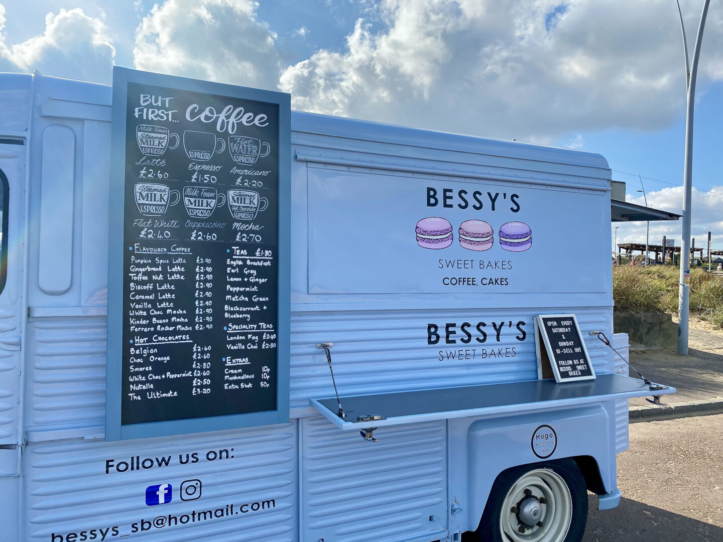 A blue cake and treats truck