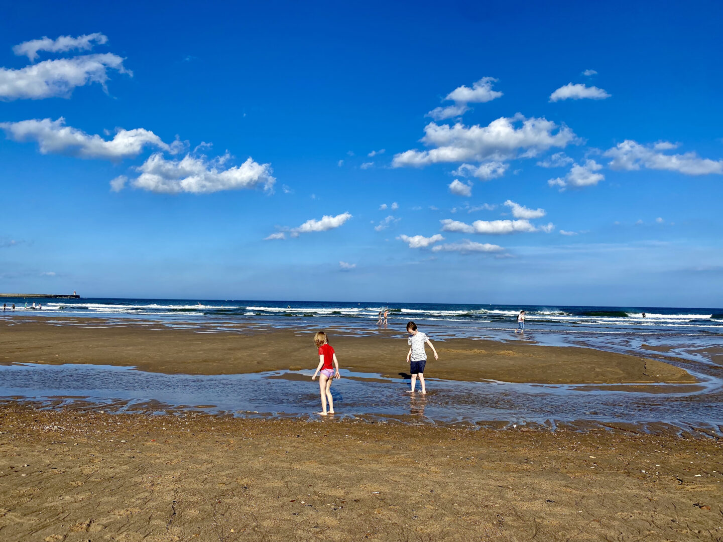 2 children playing on a beach