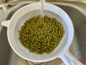 rinsing mung beans for dal