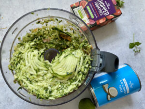 Grated sweet potato and courgette in a food processor