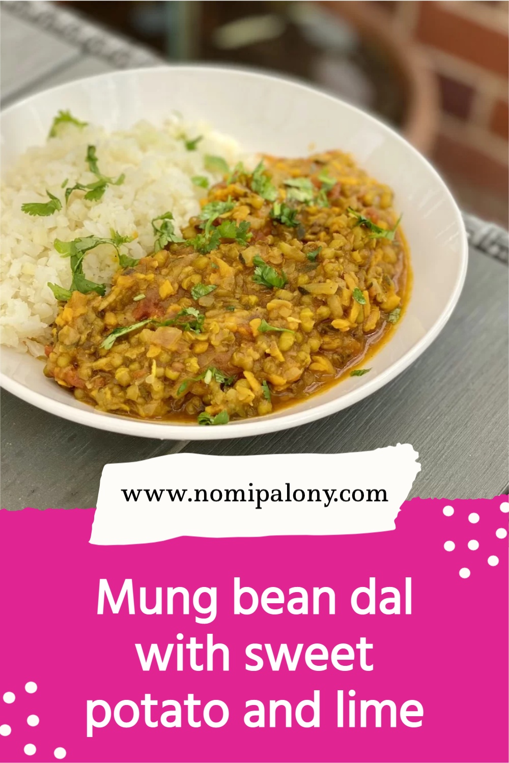 mung bean dal with sweet potato and lime in a bowl on a table with cauliflower rice and coriander