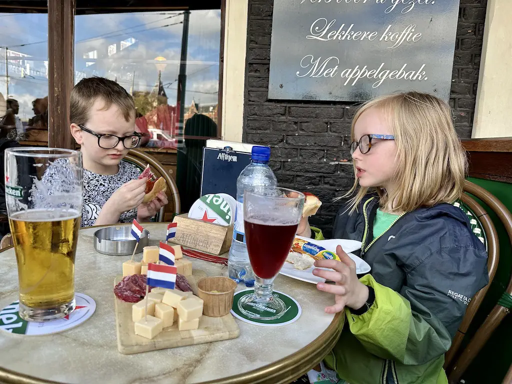 Children eating food at the oldest pub in Amsterdam