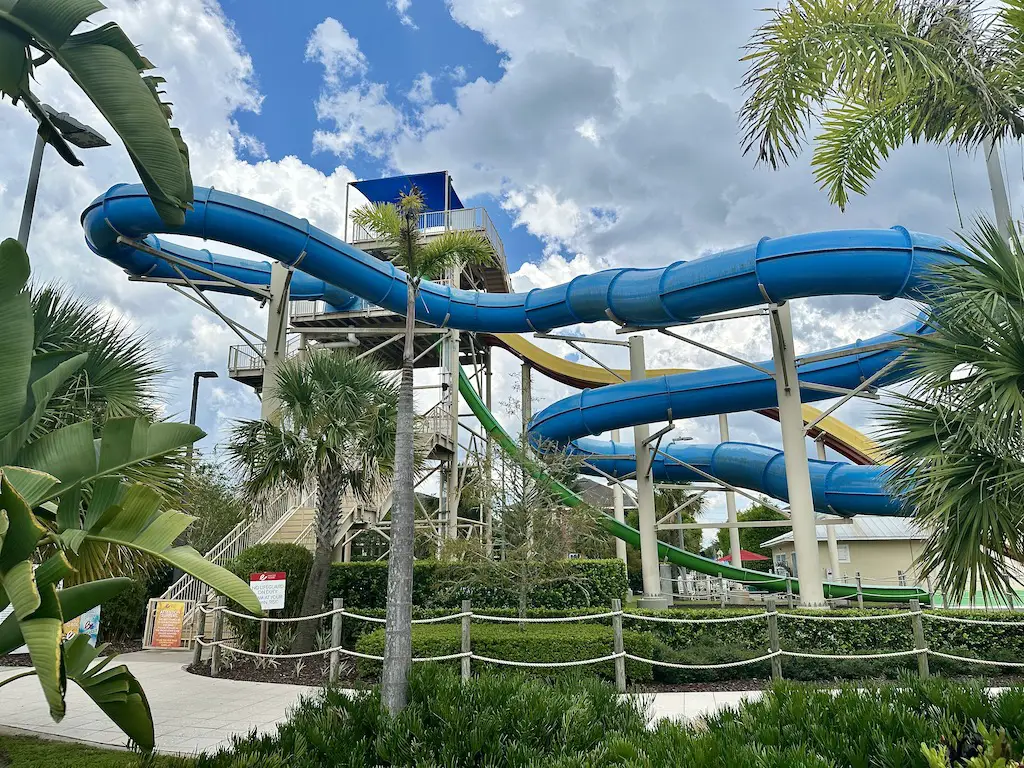 Encore resort at reunion waterpark - blue slide through palm trees 