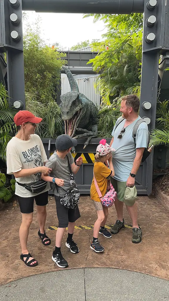 Family of 4 appears scared of raptor animatronic - 14 day Orlando itinerary 