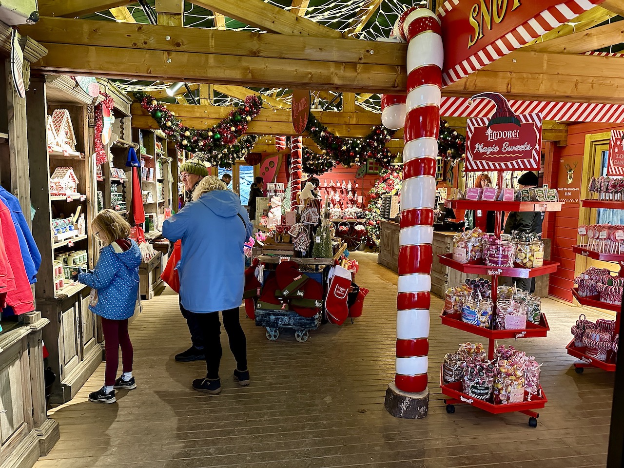 Lilidorei Christmas gift shop - a wooden shop with lots of red and white decorations