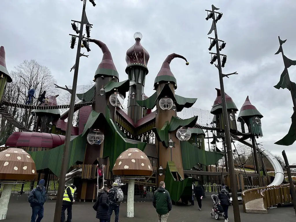 Lilidorei Elfin Drin play structure - tall play structure with elf theming of green and red with giant toadstools