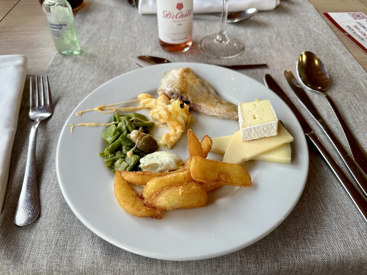 a plate that has cheese and chips on it