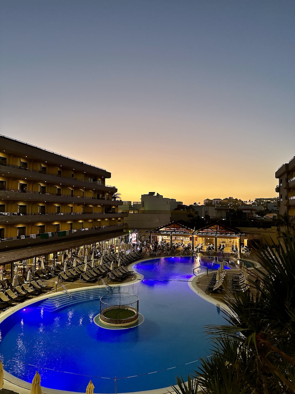 A deep blue pool at sunset